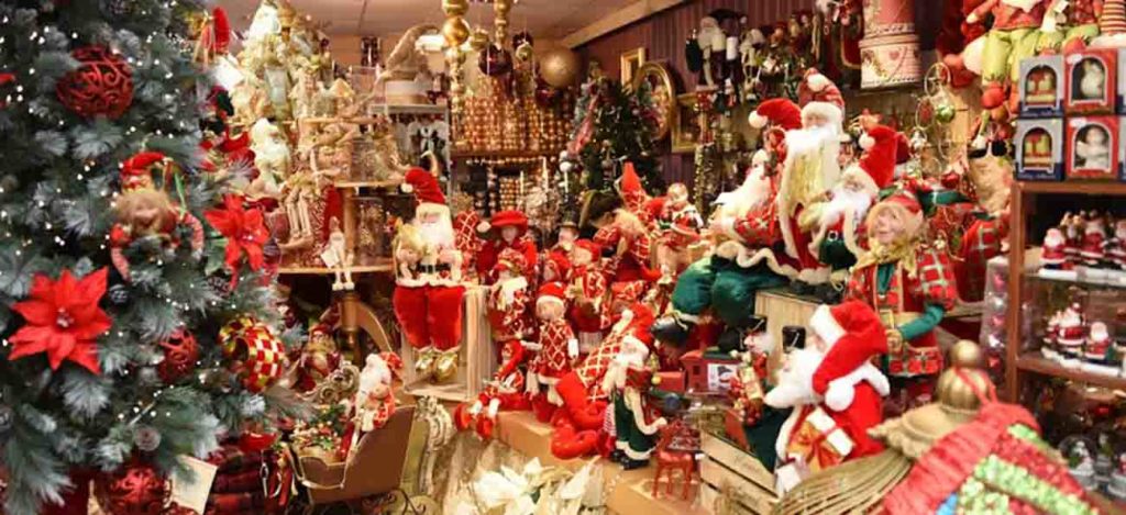 A Christmas shop filled with red and gold christmas decor