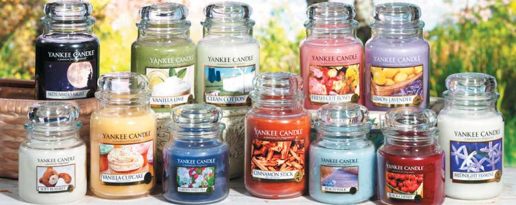 Nine large yankee candles with different scents and colours